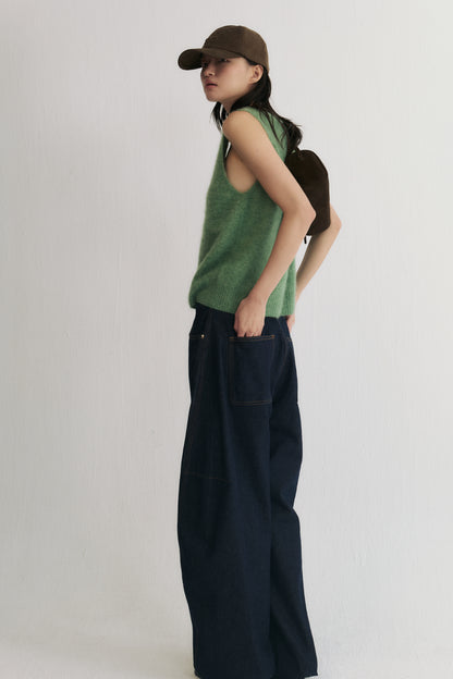 Side back view of Raw denim curved leg jeans with adjustable hem detail