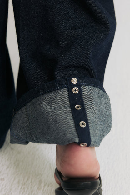 Hidden snap closure hem detail on horseshoe jeans