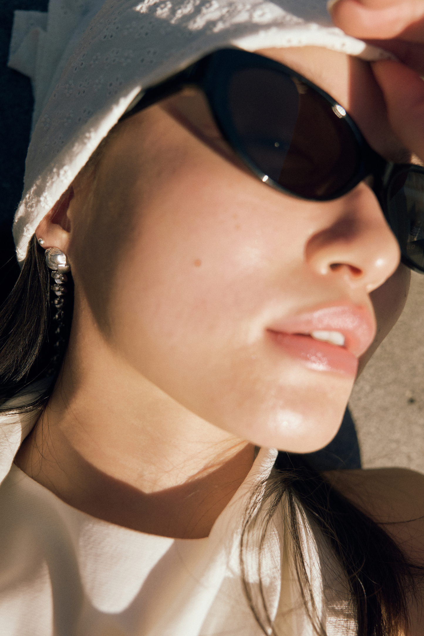 SLO Classic 001 sunglasses on model with minimalist styling