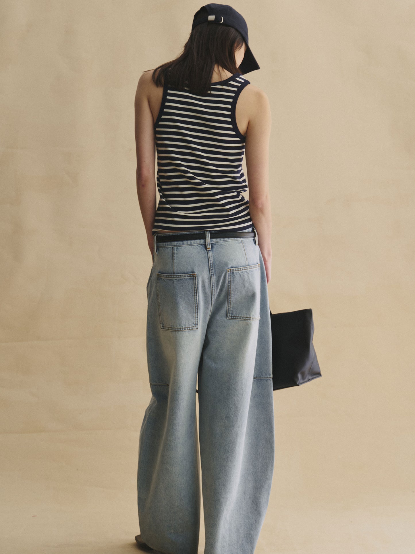 Back view of Structured horseshoe jeans in light wash blue