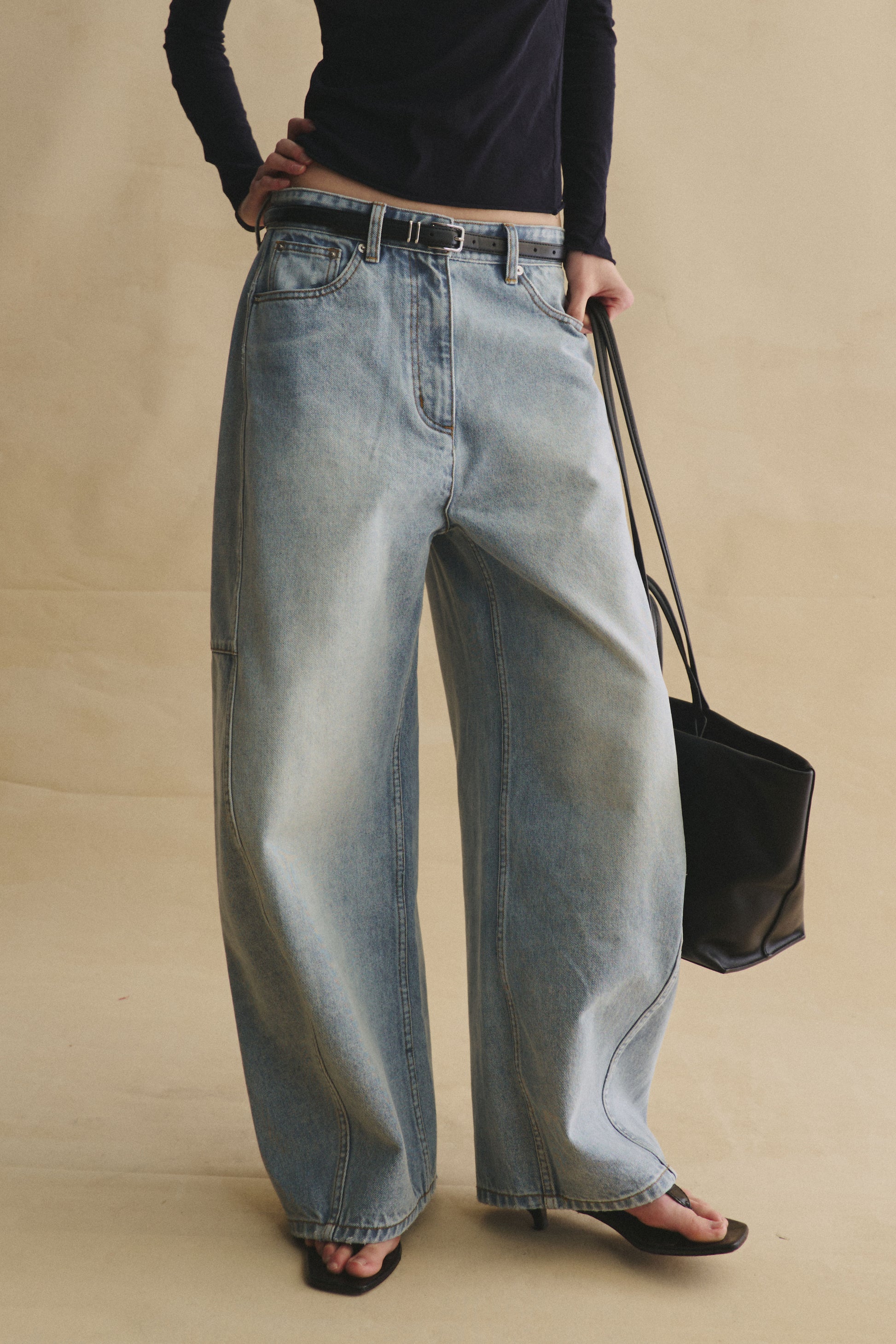 Structured horseshoe jeans in light wash blue with a high waist and relaxed curved leg silhouette